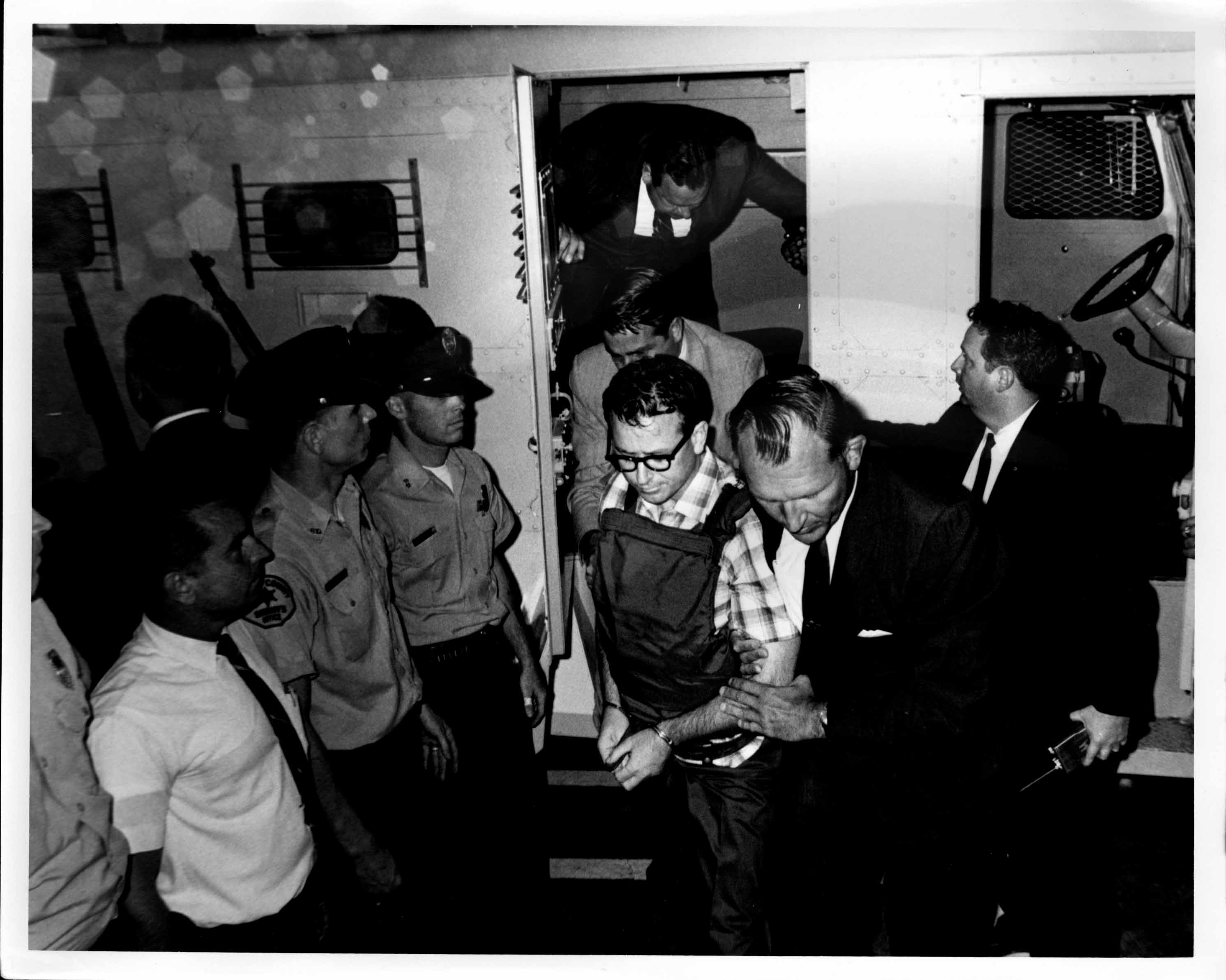 01James Earl Ray being brought into jail 01.jpg